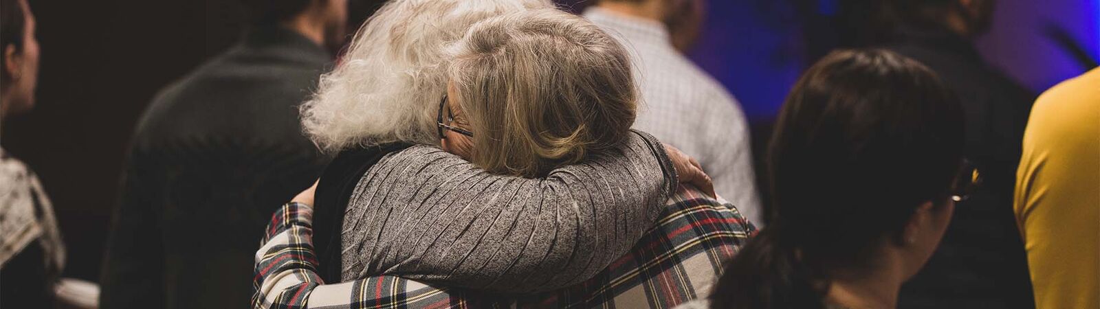 Two friends hugging at Connect Church