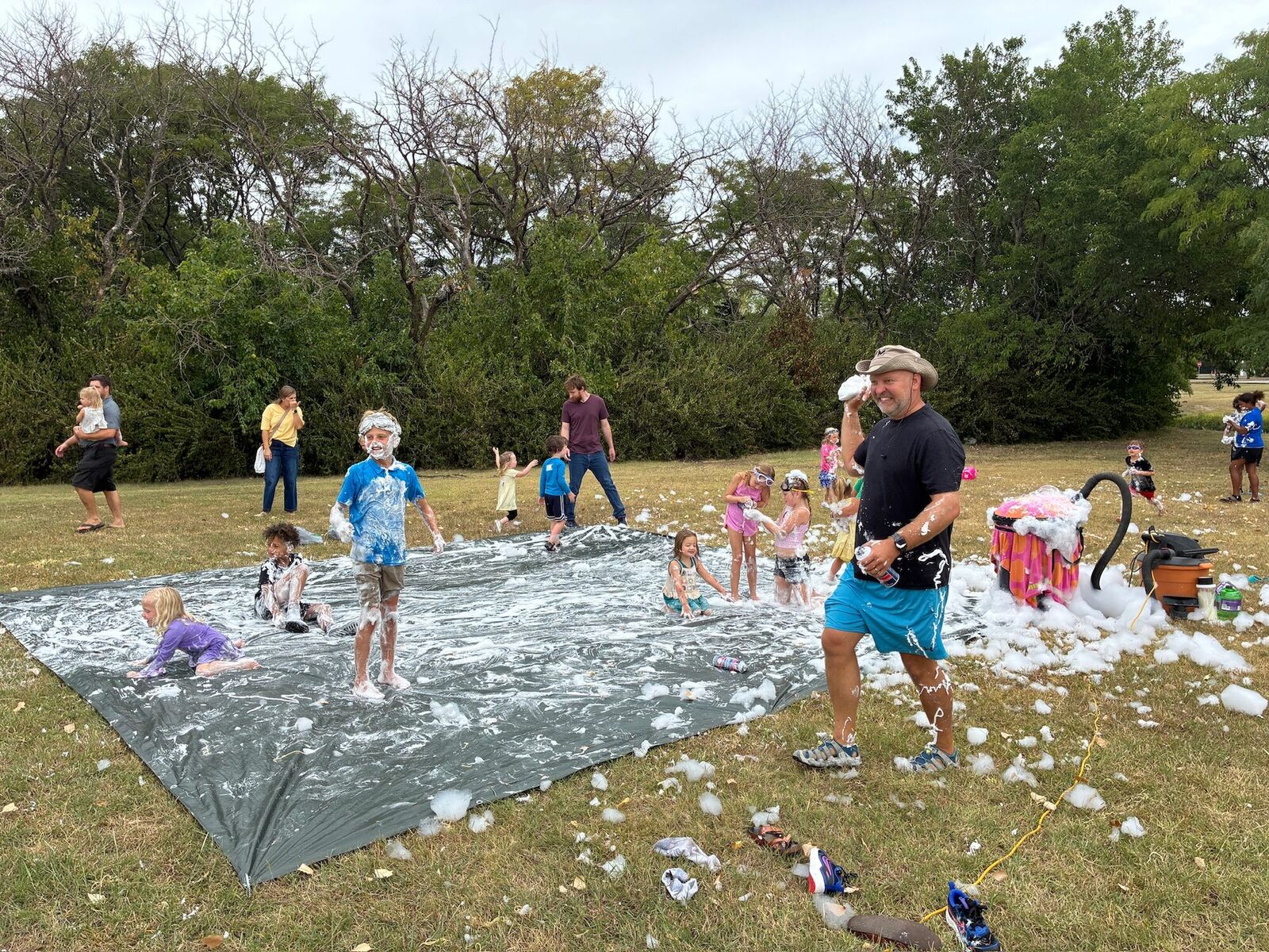 Families playing at a Connect Church outdoor foam party
